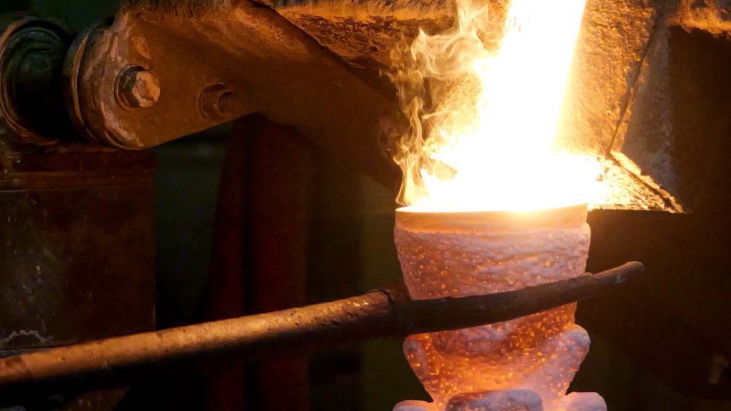 Casting at Eagle Precision: pouring investment casting mold